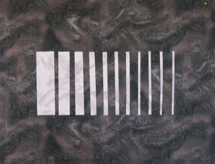 Square cut in strips showing negative space
