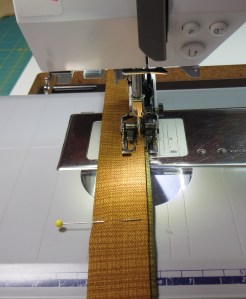 Fold the strap in half and stitch the open edge