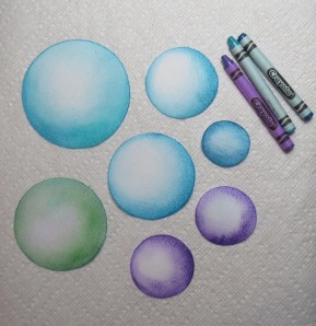 Spheres colored with melted crayons - first try