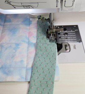 Slide the binding to the left