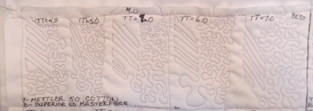 Mettler tension test.  Top thread Mettler size 50 gray.  Bottom thread Superior Masterpiece size 50 white