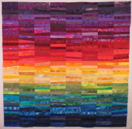 Rainbow scrap quilt based on Ann Brauer's "Rainbows of Summer", 64 in by 66 in