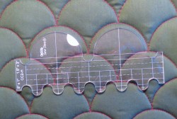 clamshell template placed on completed stitching